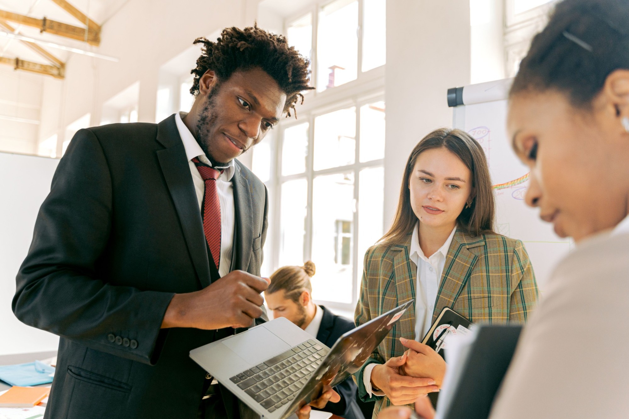 Young professionals collaborate in a bright workplace setting